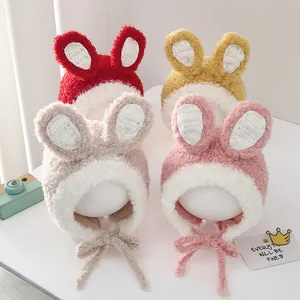 Kids plush winter rabbit ear hats in red, yellow, beige, and pink with warm earflaps