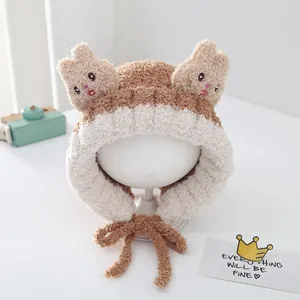Winter plush rabbit trapper hat for toddlers with brown and white faux fur and earflaps