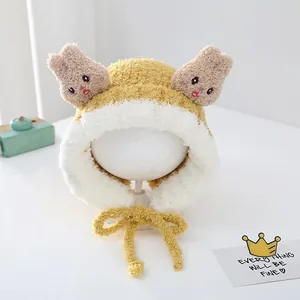 Close-up of plush rabbit winter hat with fluffy ears and embroidery for toddlers