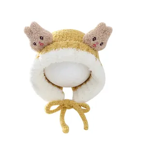 Winter cartoon rabbit plush earflap hat for kids in warm yellow with windproof straps