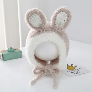 Detail of plush rabbit ears and soft knit texture on the thermal baby winter hat