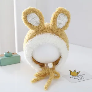 Detail view of plush bunny ears and soft fleece texture on a warm baby trapper hat