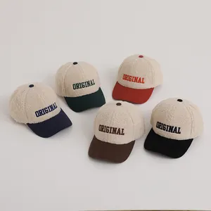 Detailed view of winter lamb wool baseball caps with colorful corduroy brims and embroidery
