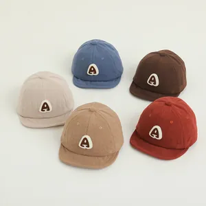 Corduroy toddler baseball caps in five colors with K letter patch and soft brim