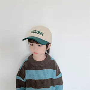 Detailed shot of kid baseball cap with sherpa fleece and green corduroy brim