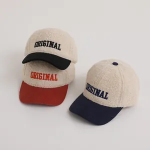 Close-up of winter kids baseball caps with lambswool crown and corduroy brim detail