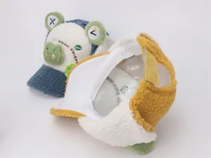 Detail of plush frog winter hat showing soft lamb wool fabric and velcro strap