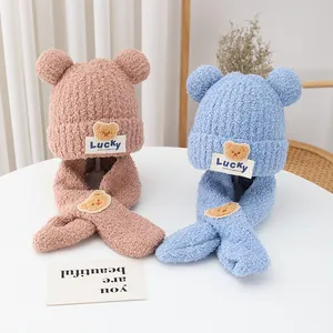Close-up of knit winter set for kids with cute bear ears and LUCKY patches in two colors