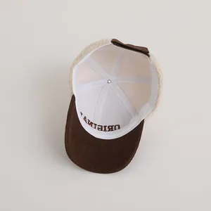 Internal detail of winter lamb wool baseball cap with corduroy brim and reinforced seams