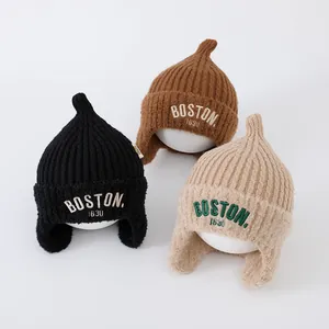 Detailed trio of knit baby beanies with Boston embroidery and cozy ear flaps