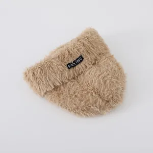 Detailed macro view of soft plush knit texture and DIDI CUTE logo on baby winter hat