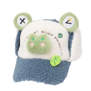 Blue and white plush frog themed winter hat for kids with cute ear flaps and embroidery