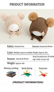 Detailed view of baby knitted hat with twin fluffy pom-poms and secure chin straps
