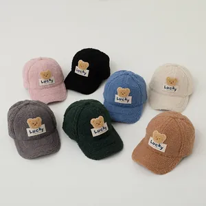 Multiple colors of teddy fleece baseball caps for kids with Lucky bear patch detail
