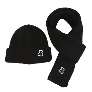 Winter knitted hat and scarf set for kids featuring a cute embroidered bear in black