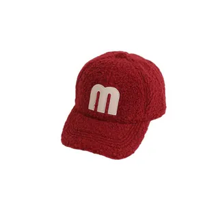 Winter fleece baseball cap for kids in deep red with white M letter embroidery