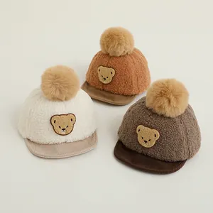 Winter baby baseball cap with plush bear ears and faux fur pompom in assorted colors