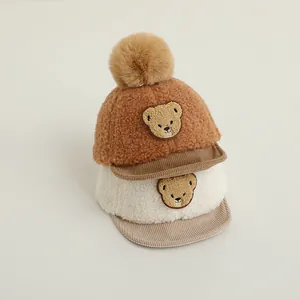 Winter infant baseball cap set with cartoon bear embroidery and fluffy pom pom details