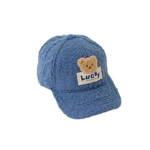 Winter Lucky Bear kids baseball cap in navy blue fuzzy fleece with plush teddy bear patch