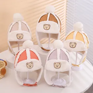 Detail showing various colors of kids aviator hats with soft faux fur lining and bear embroidery