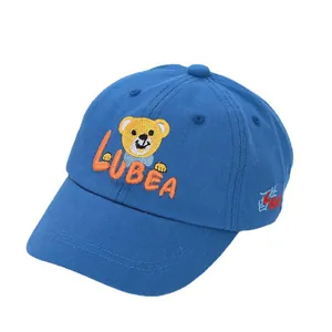 Blue cotton baby baseball cap with embroidered bear and orange letters on white background