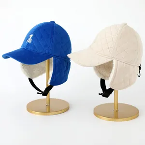 Winter aviator hats for kids with plush lining and cute bear embroidery in blue and beige