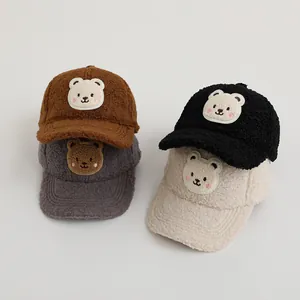 Detailed collection of four children's plush baseball caps in earthy neutral tones