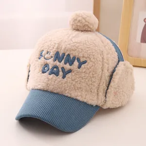 Close-up of children winter earflap hat with Sunny Day embroidery and soft plush texture