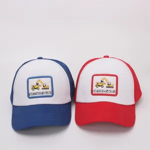 Detail of embroidered excavator patch on two-tone cotton kids baseball caps