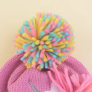 Pink unicorn knit hat for girls with colorful pom-pom and soft winter thermal texture