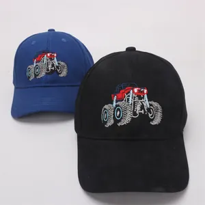 Close-up of monster truck embroidery on cotton baseball caps in black and navy blue