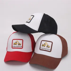 Detail of assorted mesh baseball caps for kids with excavator and truck embroidery patches