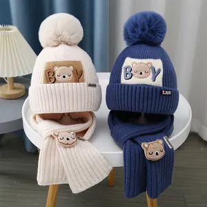 Winter kids knit hat scarf set featuring cartoon bear embroidery and fluffy pompom