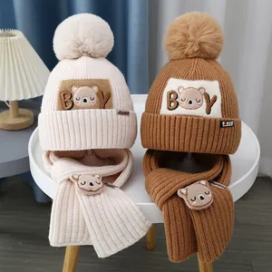 Winter knit baby beanie and scarf set with cute cartoon bear and faux fur pom-poms