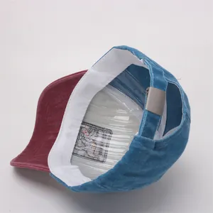 Detail view of the interior construction of a color-block baseball cap with sweatband