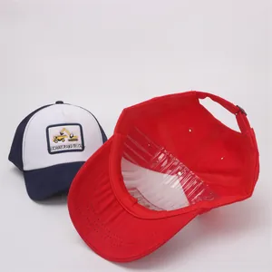 Detail view of cartoon excavator embroidery and adjustable metal buckle on kids baseball cap
