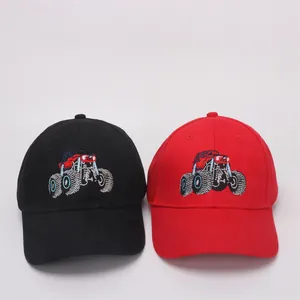 Detail of colorful monster truck embroidery on classic black and red baseball caps