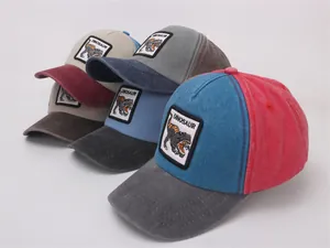 Detail of vintage dinosaur patch on colorful patchwork kids baseball caps