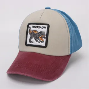 Detail of kids patchwork baseball cap with embroidered dinosaur patch and vintage wash