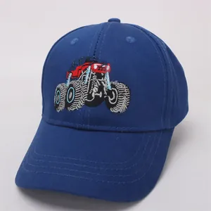 Detail of red monster truck embroidery on navy blue cotton children's baseball cap