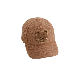Warm brown fleece baseball cap for children featuring a cute teddy bear embroidery