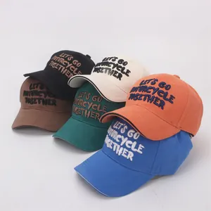 Detailed embroidery texture on various colored cotton twill baseball caps for kids