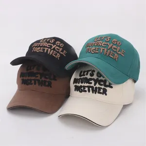 Set of four embroidered cotton baseball caps in black, cyan, brown, and off-white colors