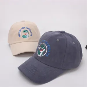 Detailed embroidery of a green dinosaur on high-quality cotton kids baseball caps