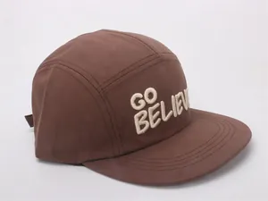 Detailed embroidery of 'GO BELIEVE' on a dark brown five-panel flat brim kids cap