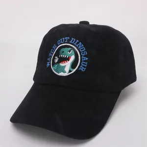 Detail of black corduroy baseball cap with green dinosaur embroidery for children