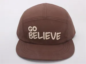 Close-up of GO BELIEVE embroidery on premium brown cotton five-panel flat brim cap