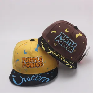 Kids flat brim snapback hat with Turtle Power embroidery and unicorn star print