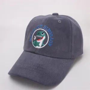 Detail of grey-blue cotton baseball cap showing high-quality cartoon dinosaur embroidery