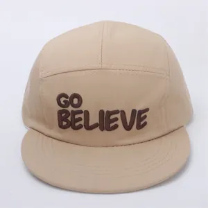Detail of khaki kids hip hop hat featuring GO BELIEVE embroidery on premium cotton twill